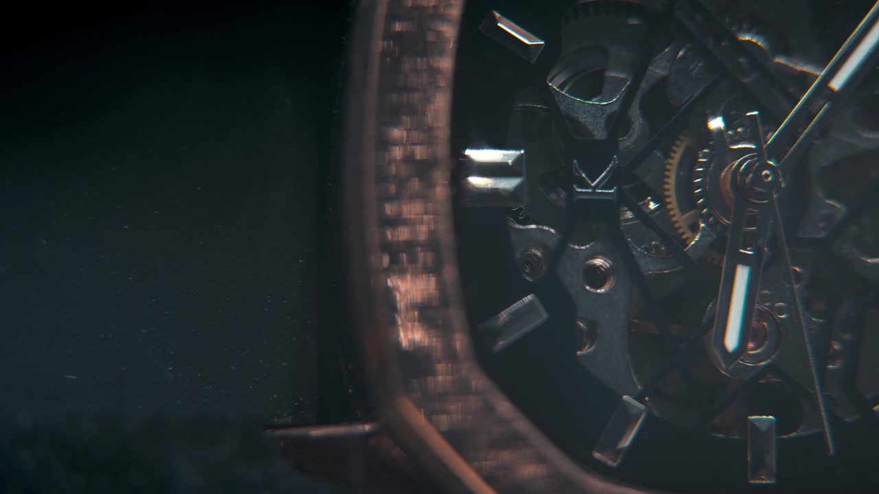 A macro slose-up shot of a mechanic hand watch, vintage technology, retro mechanism, octagon goden design, cinematic studio lighting, commercial footage, detailet 4K video, pan right