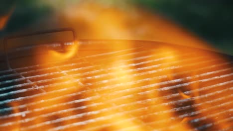 close up of a grill with dancing hot fire flames