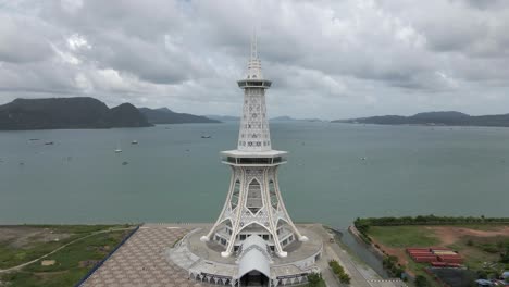 Aerial-flight-to-Maha-Tower-on-developing-tourism-waterfront,-Langkawi