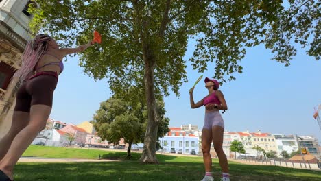 people playing in the park on a sunny day