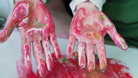 Paint-artist's-hands-covered-with-paint