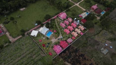 Aerial-shot-of-a-group-of-houses-in-the-jungle