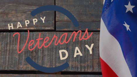 animation of happy veterans day text over american flag and wooden background