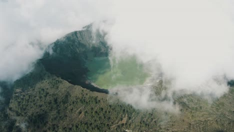 volcanic crater el chichonal in chiapas, mexico on a cloudy day - aerial drone shot