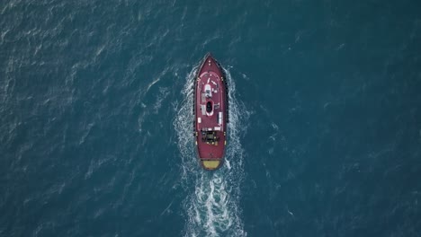 tug boat in the middle of a blue sea