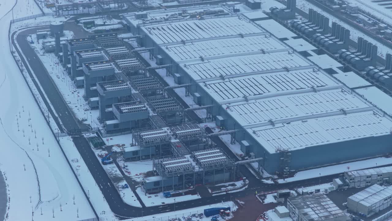 Aerial view of a snow covered large data center industrial building