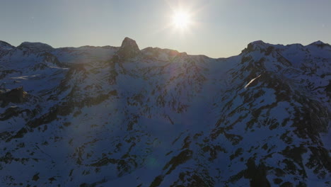 snowy mountain peaks at sunrise/sunset