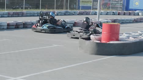 kyiv, ukraine - august 2021: a young man drives a go kart at circuit