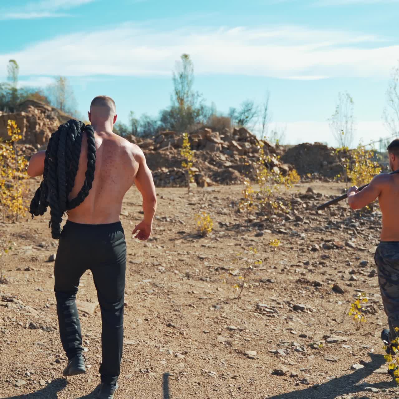 . Fitness Training Outdoor. Young muscular men outdoor exercising in nature