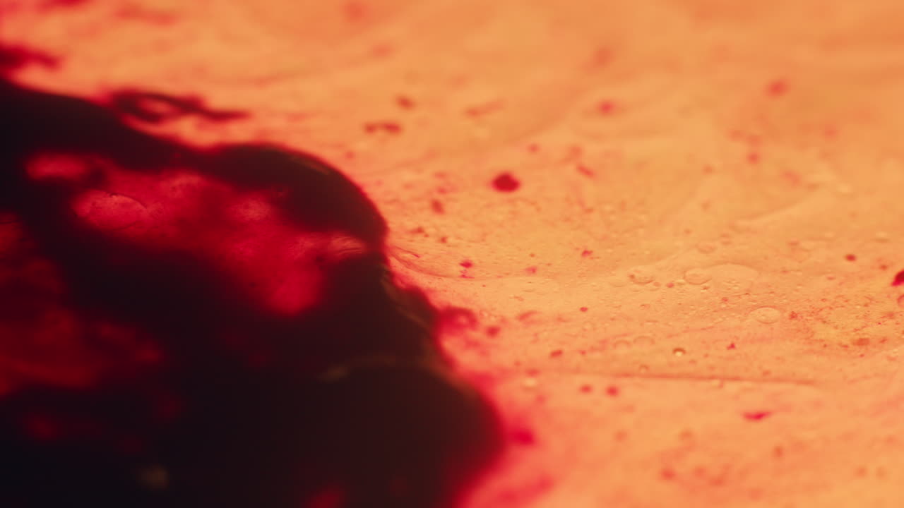 Colourful, organic, liquids macro shots buzzing and flowing