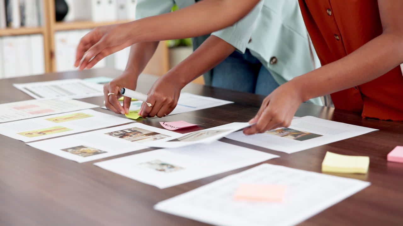 Business People Collaborating on Documents and Sticky Notes in Office