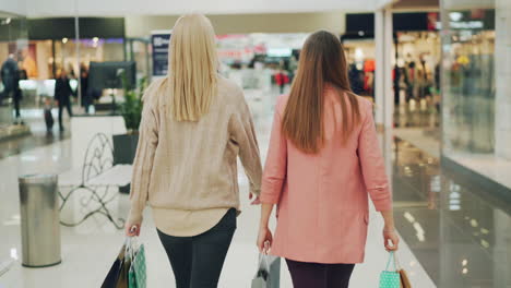 two women shopping in a mall