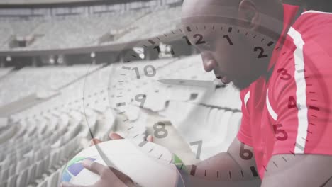 animation of clock ticking over african american male rugby player