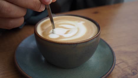 a closeup of a latte with latte art