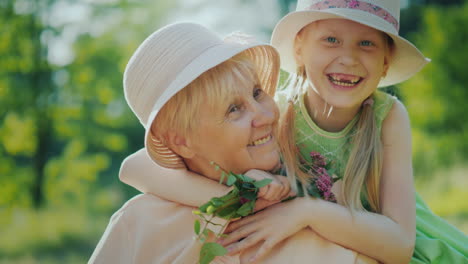 The-Carefree-Girl-Runs-To-Her-Grandmother-And-Embraces-Her-Emotionally-Granddaughter-And-Grandmother