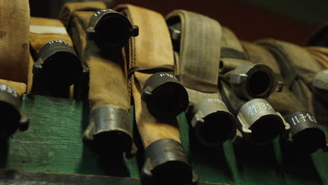 fire hoses laying over eatchother, close up of equipment of a fire department to extinguish the fire, showing around 13 different hoses