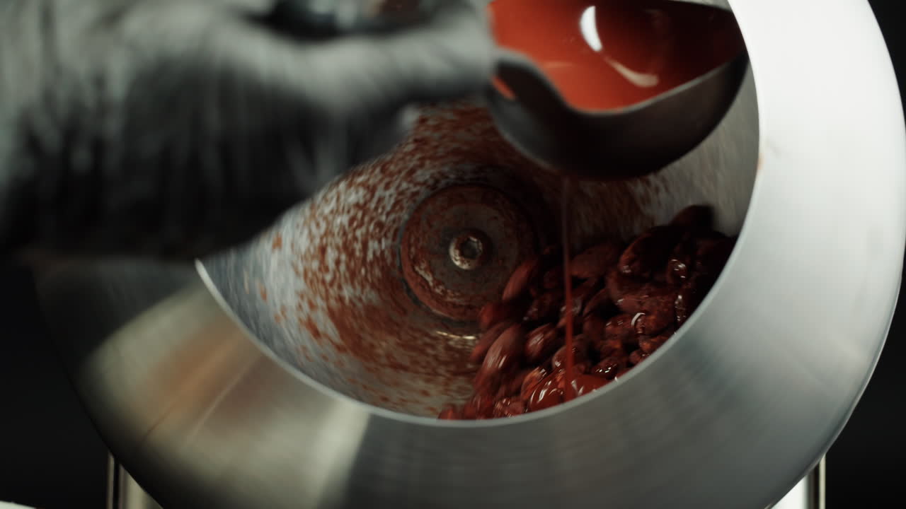 Chocolate-Covered Almonds Being Prepared