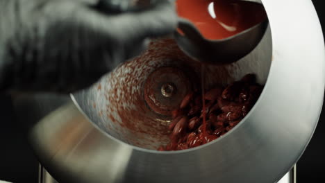 chocolate-covered almonds being prepared