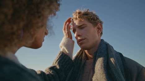 Romantic sweethearts enjoying date windy nature closeup. Lovers enjoy intimacy