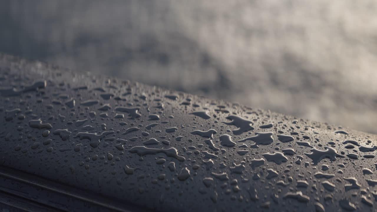 Water drops on a boat's edge with blurred water waves