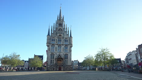 town hall building on the central market square of gouda, netherlands - panning