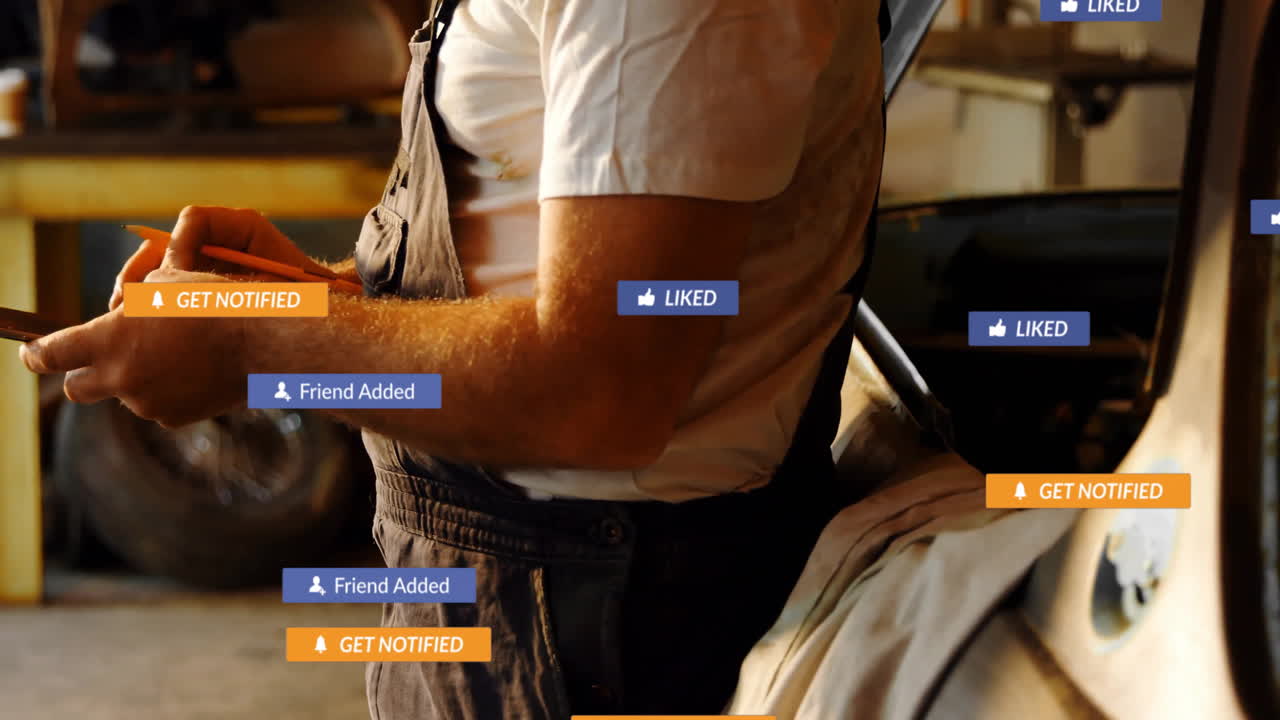 mechanic marking notes in automotive workshop, with floating social media notification graphics