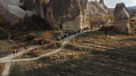 famous horseback riding tour for tourists visiting the goreme national park in cappadocia, turkey