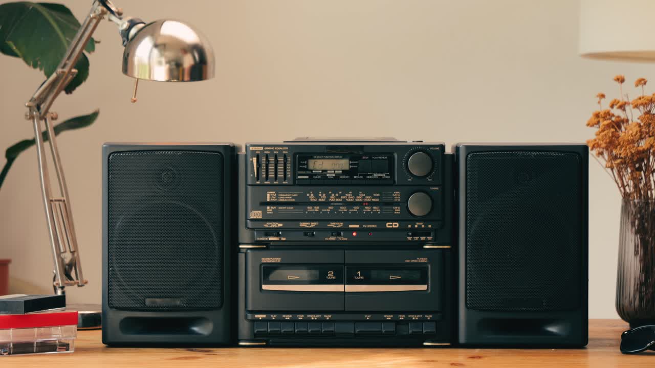 Retro radio tape recorder, audio cassette close-up. Listening to music, old radio boom box player, macro of vintage music listening. . High quality 4k footage