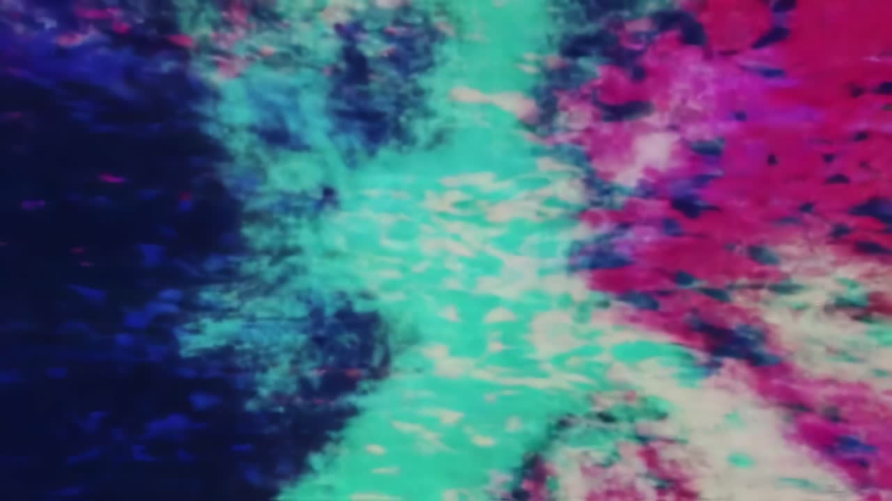 Vibrant Abstract Patterns Emerge in Fluid Motion, Showcasing a Kaleidoscope of Color from Electric Blues to Fiery Reds in Dynamic Visual Rhythm