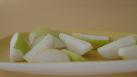 sliced pears on a yellow plate