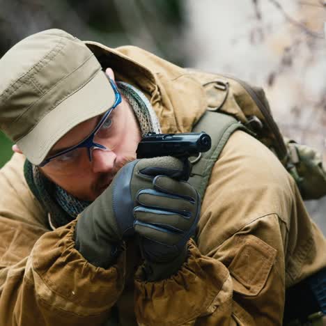 a man plays airsoft with a pistol in his hand 2