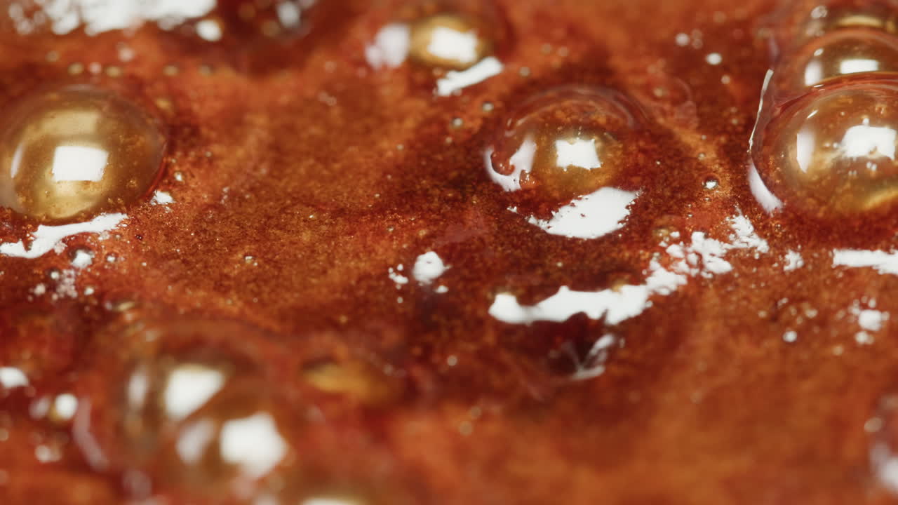 Close-up of a Brown Liquid with Bubbles