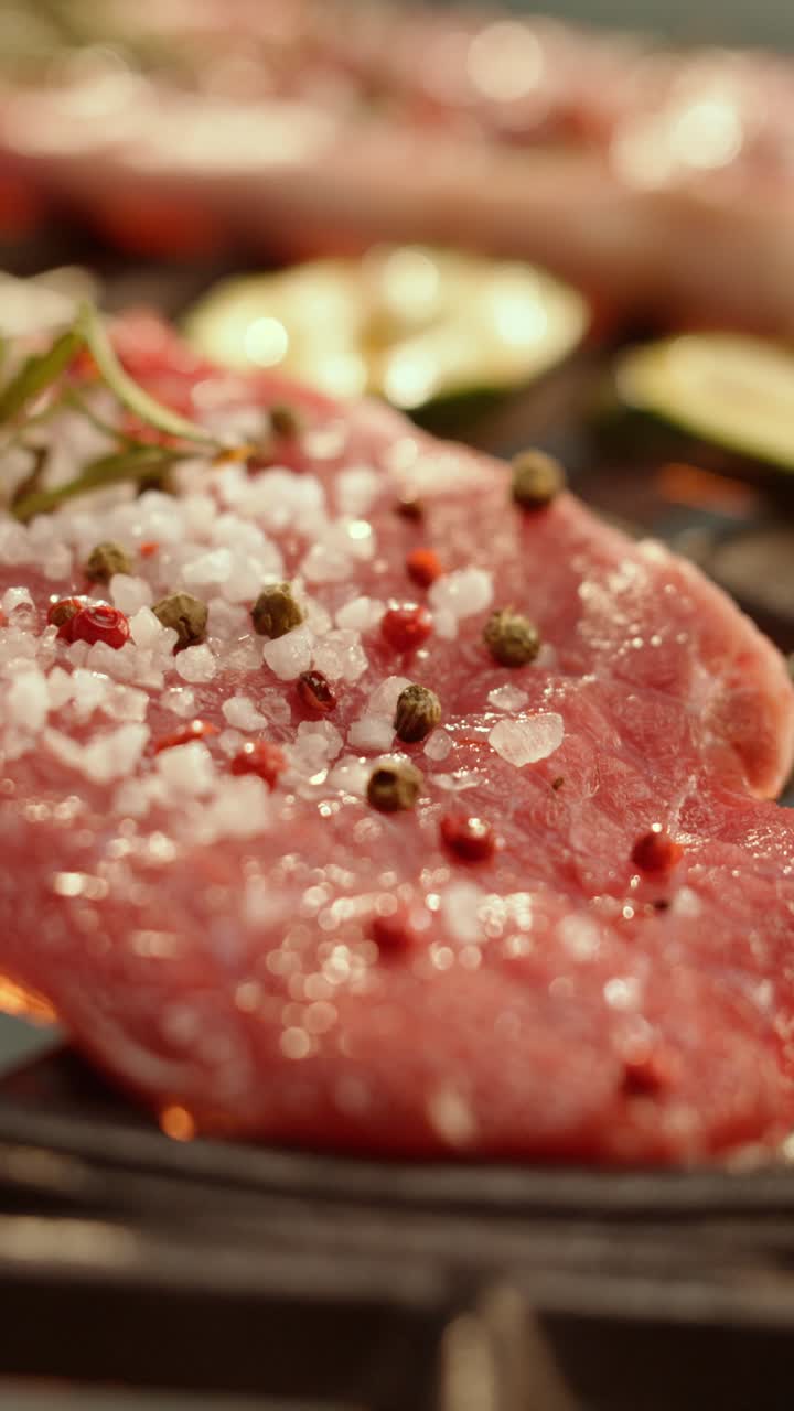 Steak on the Grill with Salt, Pepper, and Rosemary