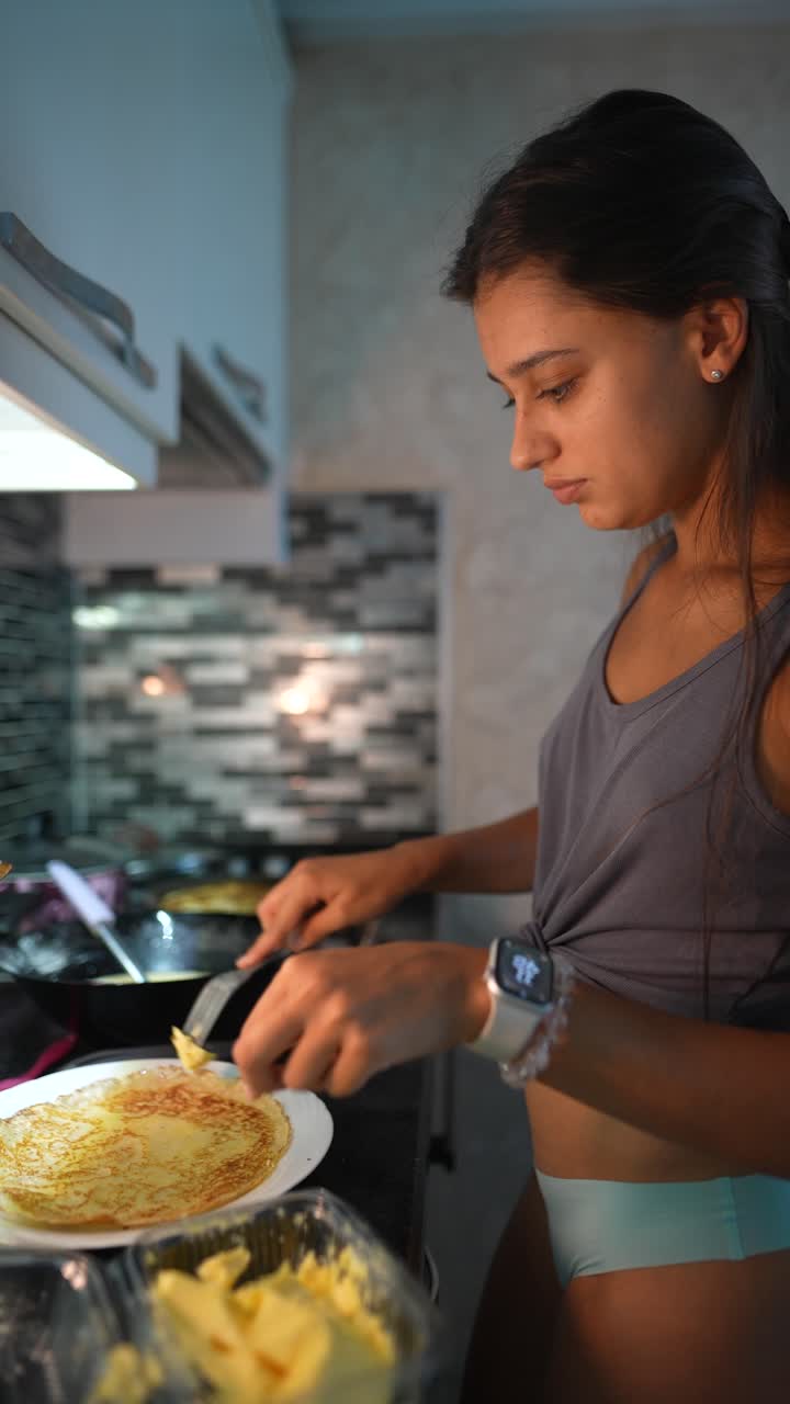 Teenage Girl Making Pancakes