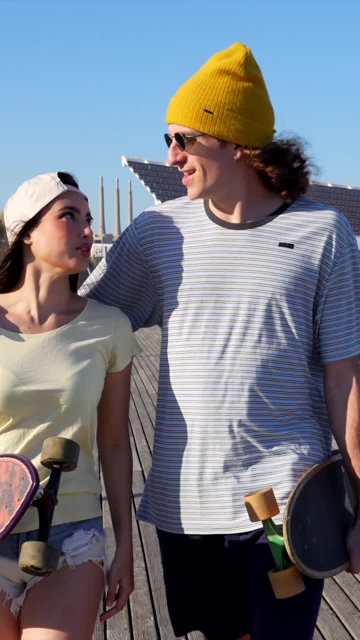 Young Couple Skateboarding Together