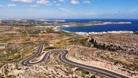 aerial drone video from malta, mellieha area, looking at mellieha bay