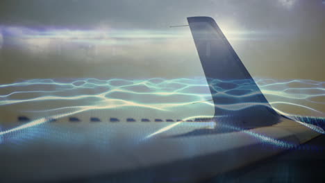 digital wave animation overlaying airplane wing with sky background in motion