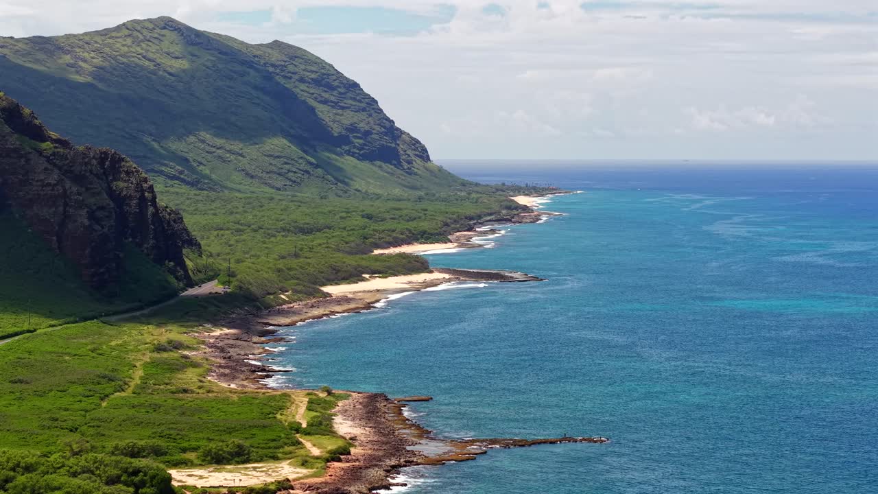 Scenic highway along a rocky mountain coastline on the island of Oahu Hawaii