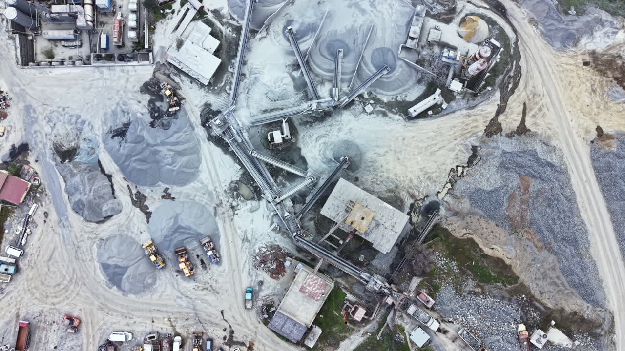 Granite quarry view showing machinery and materials at work on a sunny day