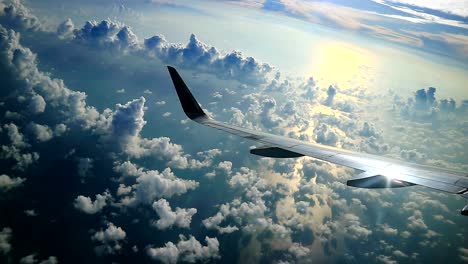 view of dramatic morning sky from commercial airplane while maneuver