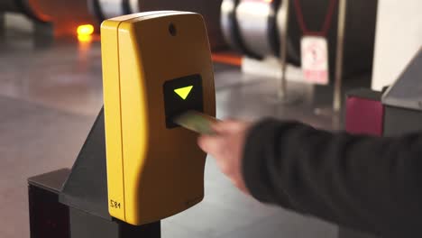 Marking-ticket-in-Prague-metro-or-subway,-yellow-machine-closeup-view,-Czech-Republic-cheap-public-transport