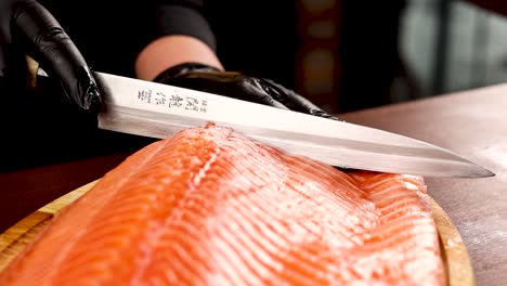 chef preparing salmon sashimi