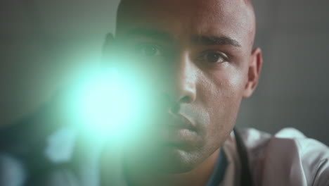 portrait african american therapist checking light reaction in clinic ward.