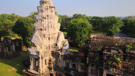 AERIAL:-Medium-shot-of-an-ancient-temple-in-Thailand-at-sunrise