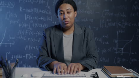 black woman teacher explains math concepts