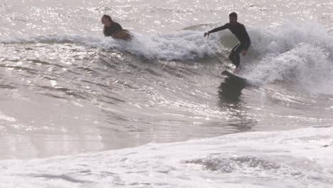 male surfer riding a wave