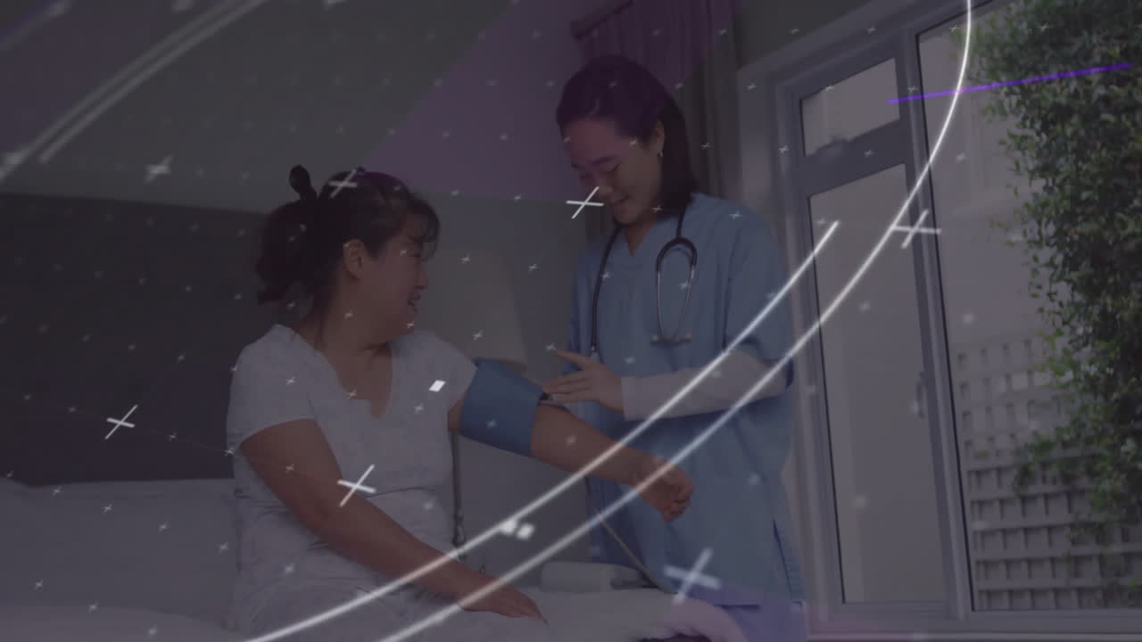 Nurse fitting blood pressure cuff on patient in clinic, overlaying glowing data graphics