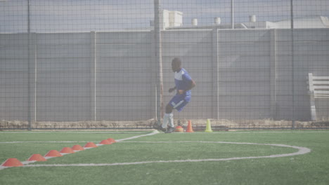 animation of data processing over male football player warming up on football pitch