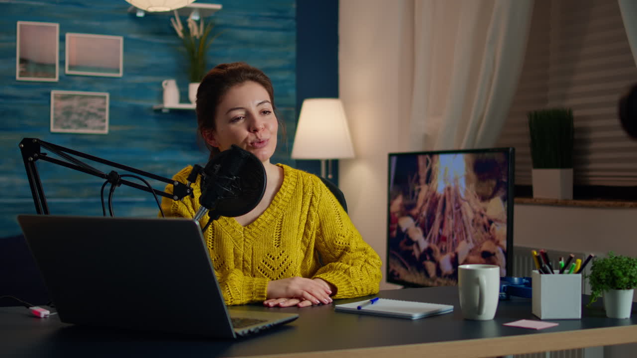 Social media star talking at camera and recording podcast