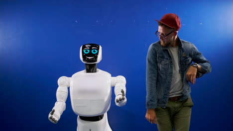 man interacting with a robot